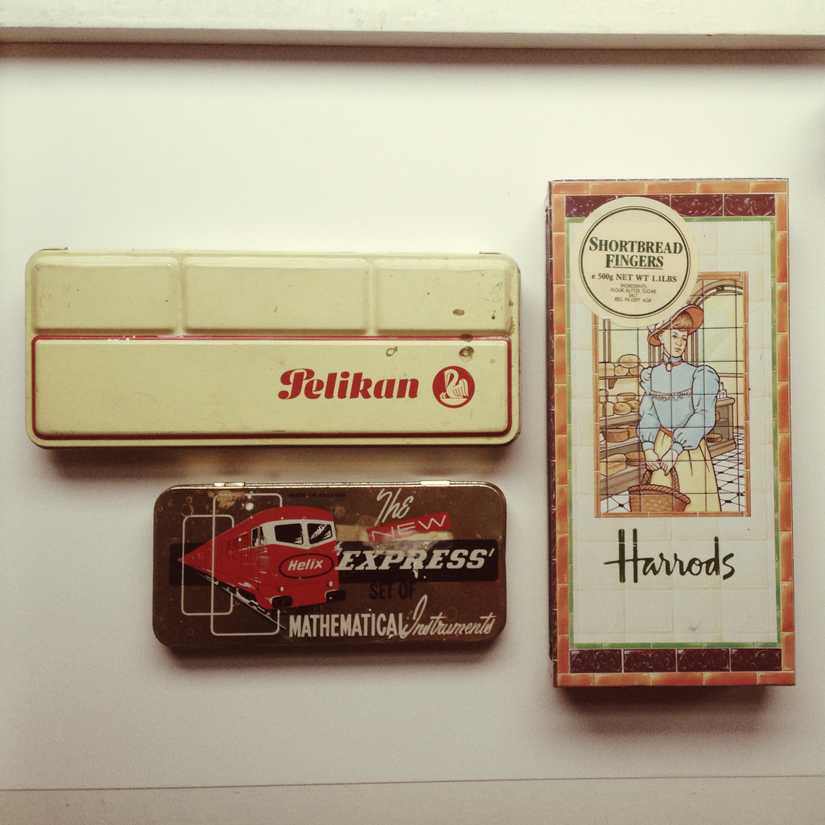 Vintage tins including a Pelikan watercolours tin, a Helix mathematical instruments tin, and a Harrods tin.