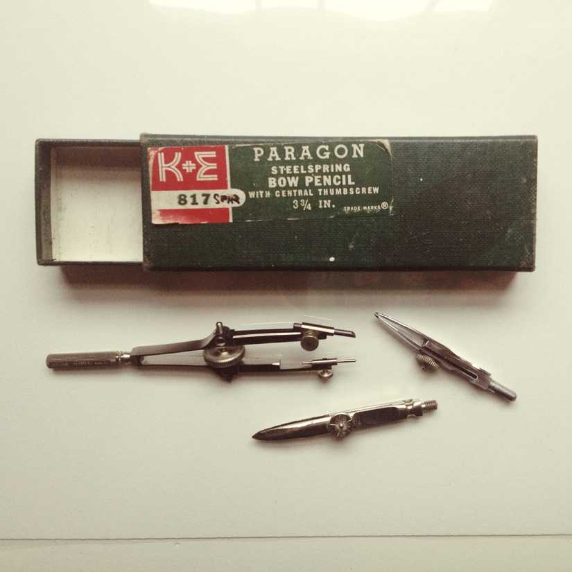 Packaging for a Paragon steelspring bow pencil and drawing compass parts below it